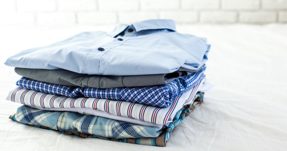 Fire and water damaged clothes - The WashRoom Laundry Service Neatly folded button-down shirts restored through professional smoke damaged clothing restoration