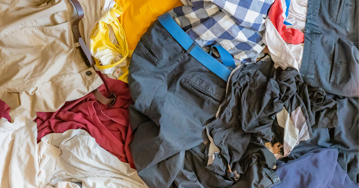 textile restoration - The WashRoom Laundry Service Pile of clothes and textiles in need of professional smoke damage or water damage restoration