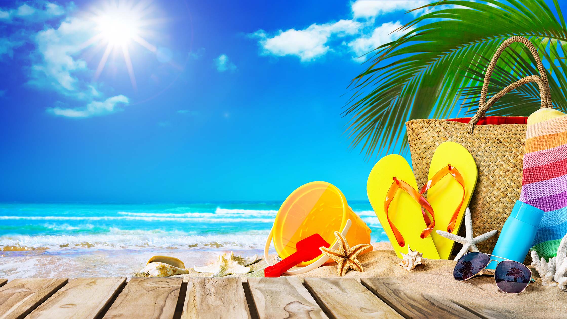 Tropical beach with sunbathing accessories, summer holiday backg summer travel - The WashRoom Laundry Service